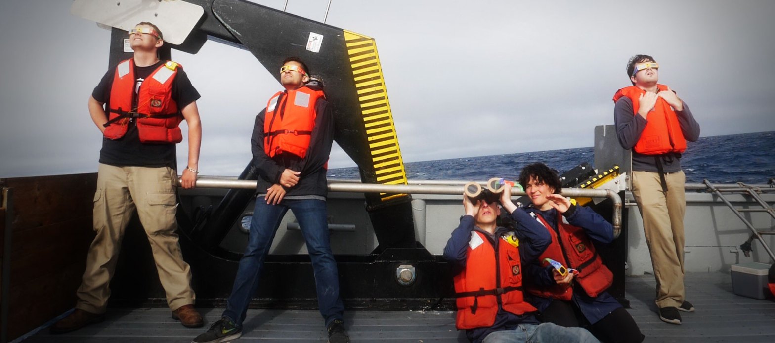 People on ship looking at eclipse